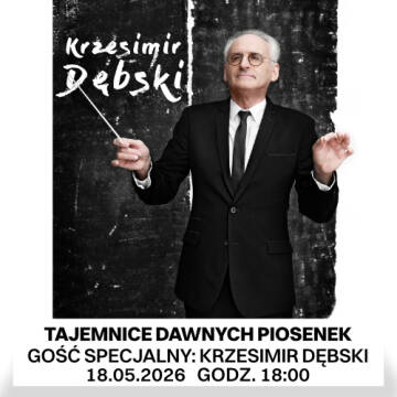 Zdjęcie przedstawia dyrygenta z batutą w ręku